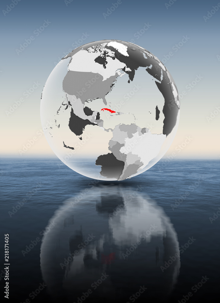 Cuba on translucent globe above water Cuba on translucent globe above water