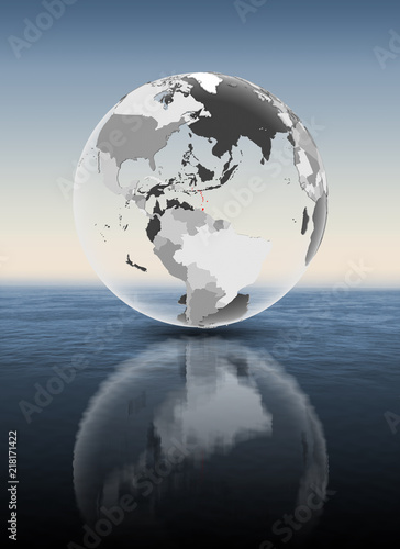 Caribbean on translucent globe above water