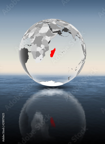 Fototapeta Naklejka Na Ścianę i Meble -  Madagascar on translucent globe above water