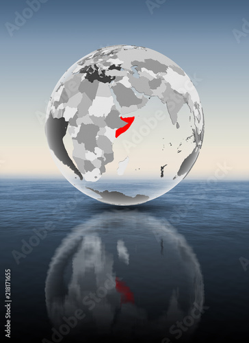 Fototapeta Naklejka Na Ścianę i Meble -  Somalia on translucent globe above water