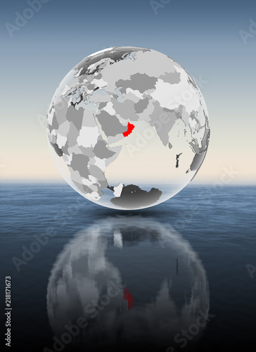 Oman on translucent globe above water