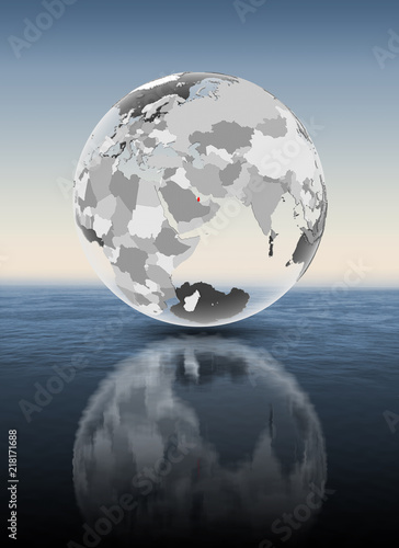 Qatar on translucent globe above water