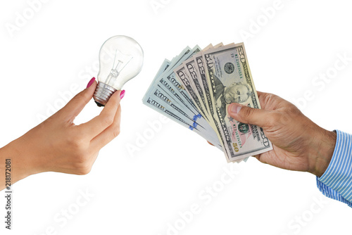Картината върху платно Offering money for brilliant ideas with light bulb and cash money isolated on wh