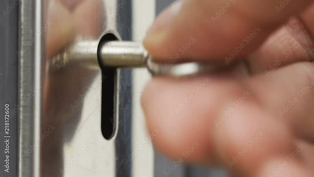 Closeup hand of someone is using key open the door Closeup hand of someone is using key open the door