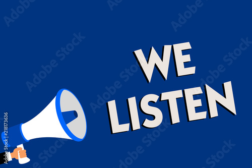 Writing note showing We Listen. Business photo showcasing Group of people that is willing to hear anything you want to say Man holding megaphone loudspeaker blue background message speaking. photo