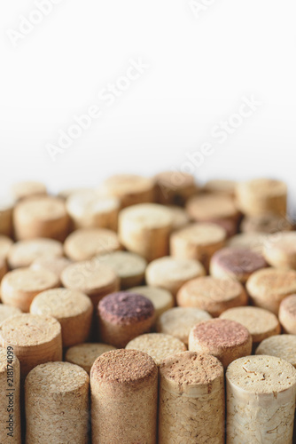 Pile of assorted used wine corks isolated on white background. Close up view.