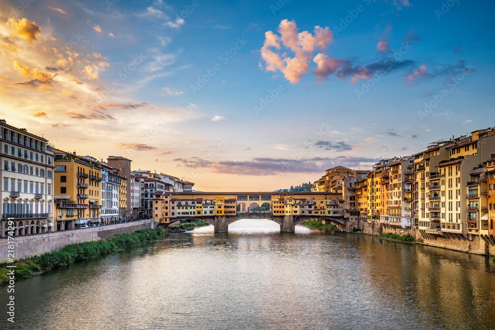 Sunrise over Ponte Vecchio in Florence, Italy, on a summer day. Colorful travel background.