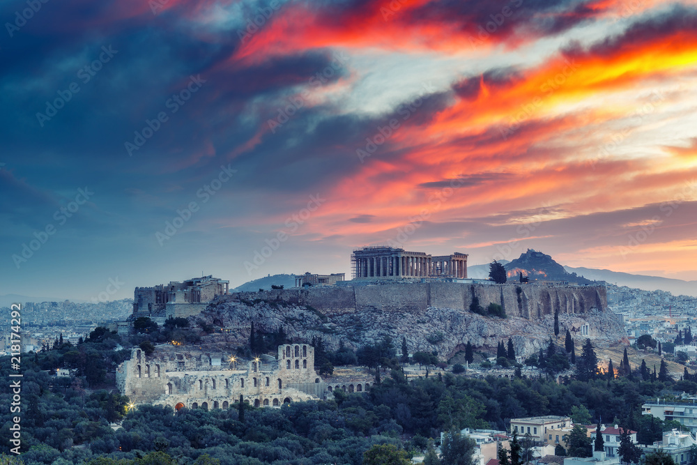 The Acropolis in Athens, Greece at sunrise. Scenic travel background with dramatic sky.