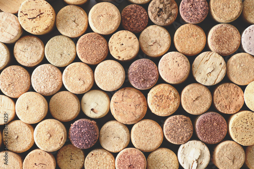 Pile of assorted used wine corks background. Close up top view. photo