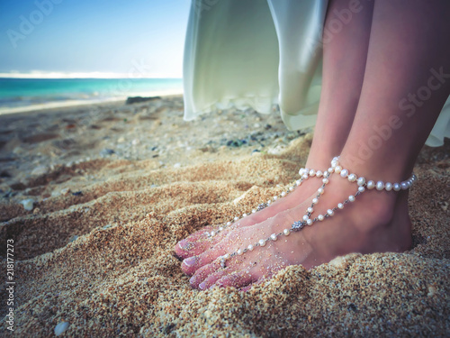 Closeup Decorated Bridal Foots of Beautiful bride at beach, Bali.