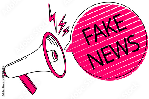 Text sign showing Fake News. Conceptual photo Giving information to people that is not true by the media Megaphone loudspeaker pink speech bubble stripes important loud message. photo