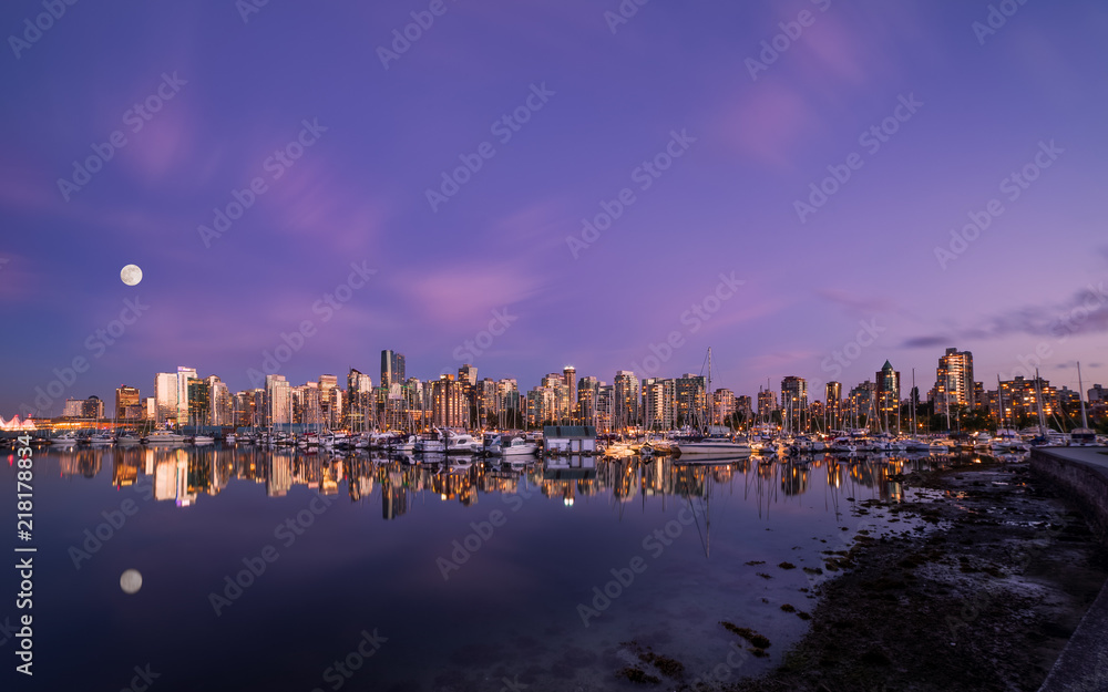Moon over Downtown Vancouver at sunset from Stanley Park.