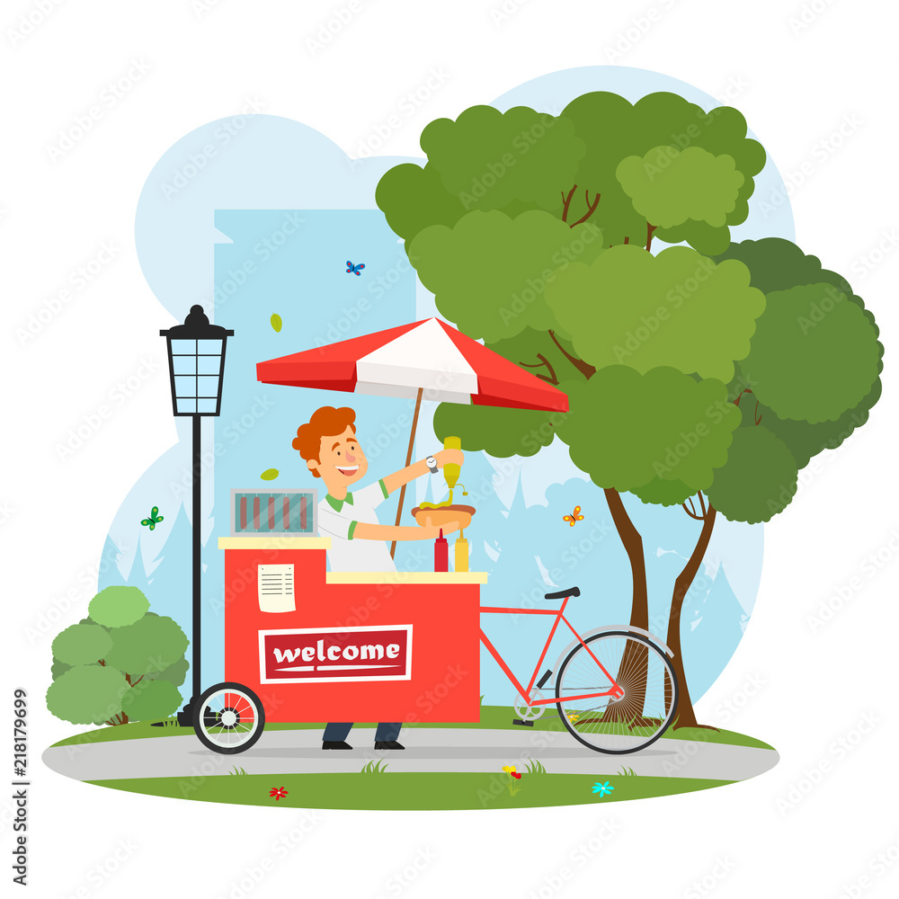 Obraz premium seller of hot dogs with a mobile cart in the city park.