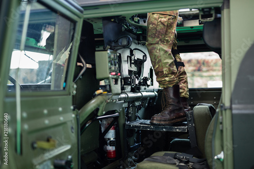 View of a Soldier Standing inside the Military Vehicle