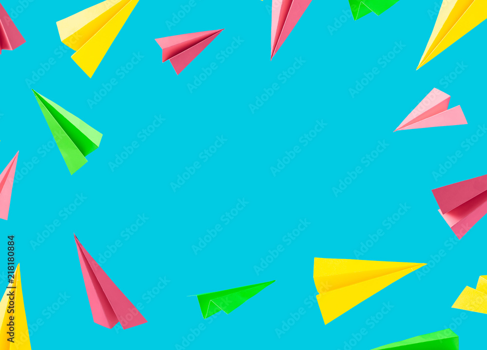 Colorful background pattern made with paper airplanes on sky blue background. Minimal back to school concept. Colorful background pattern made with paper airplanes on sky blue background. Minimal back to school concept.