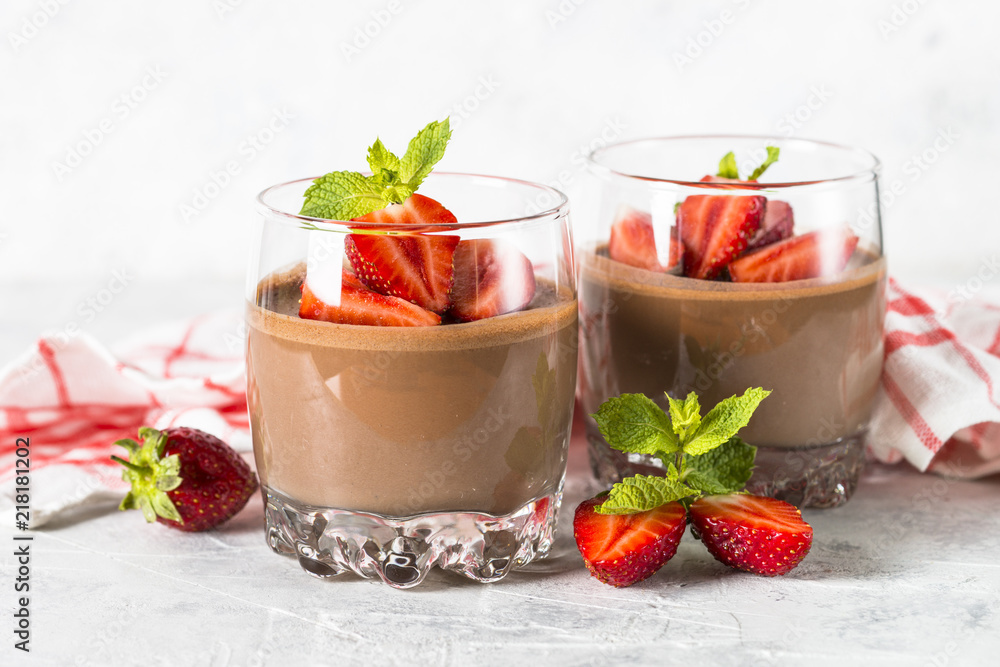 Chocolate dessert of whipped cream and strawberries in glass. Chocolate dessert of whipped cream and strawberries in glass.