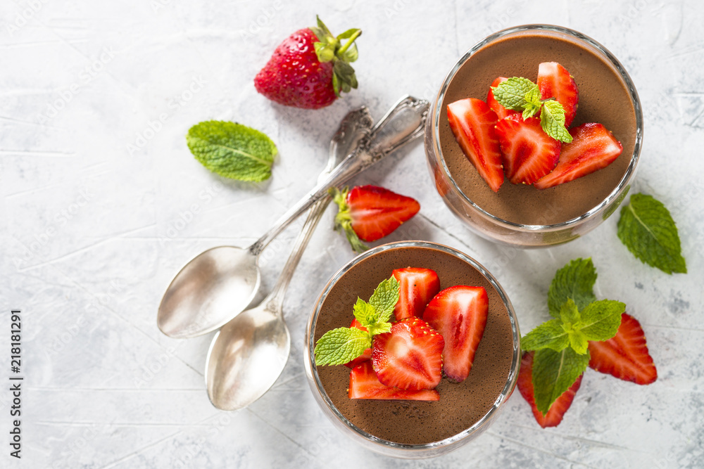 Chocolate dessert of whipped cream and strawberries in glass. Chocolate dessert of whipped cream and strawberries in glass.