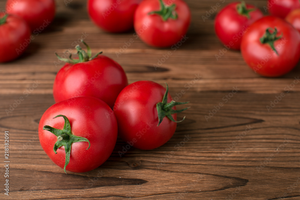 tomatoes on wooden background tomatoes on wooden background