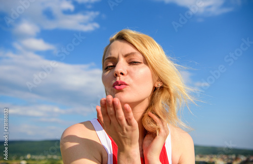 Ultimate art of seduction. Girl blonde lady smiling enjoy freedom and fresh wind blue sky background. Woman red dress feels carefree and free. Flirt and coquette concept. Girl playful mood coquette © be free