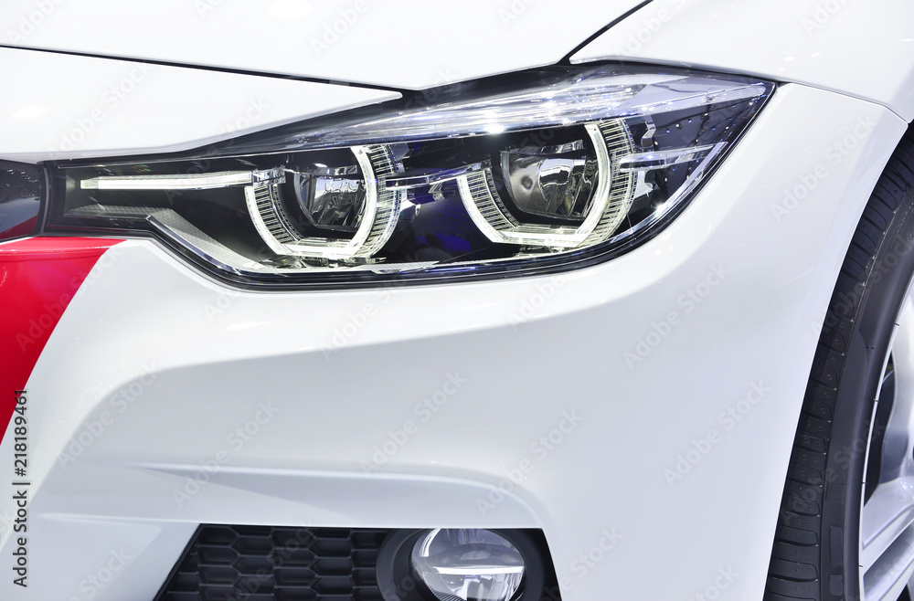 Close up detail on one of the LED headlights modern car. - obrazy, fototapety, plakaty 