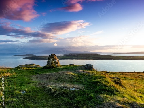 Just after sunset looking over the Cumbrae Isles towards Arran, on the West coast of Scotland. photo