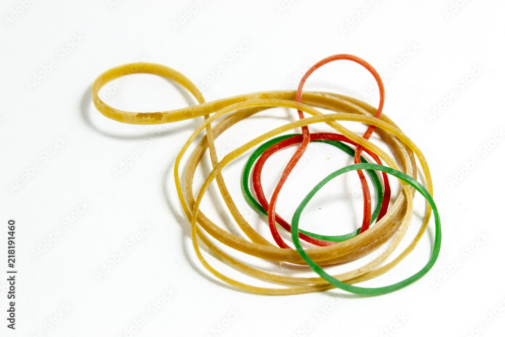 Close-up shot of colorful rubber band with blurry white background Close-up shot of colorful rubber band with blurry white background