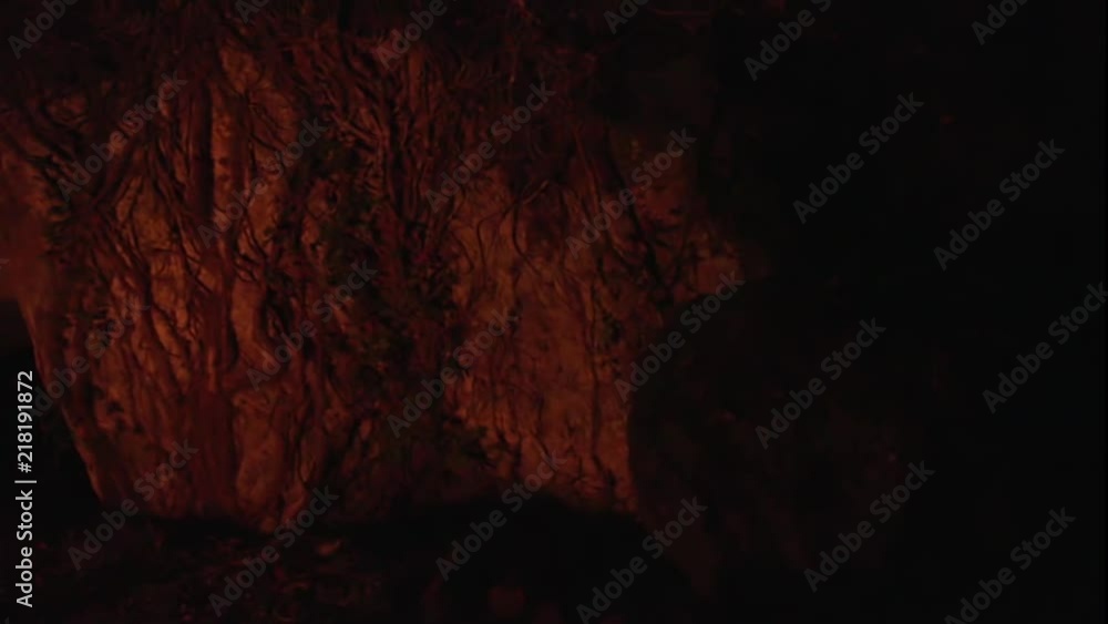 Old tuff caves with shadows from a fire in the night Old tuff caves with shadows from a fire in the night