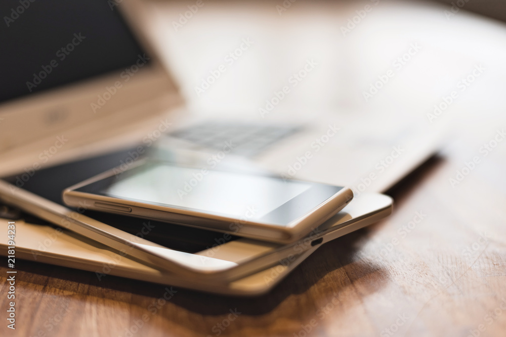 phone and tablet on a laptop phone and tablet on a laptop