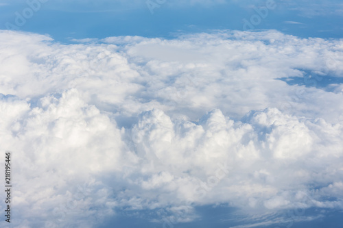Cloud cumulus from the altitude of the airplane flight, the atmosphere weather. © aapsky