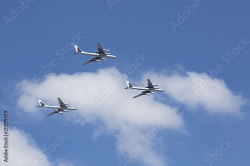 Beautiful picture of several planes flying in blue sky.