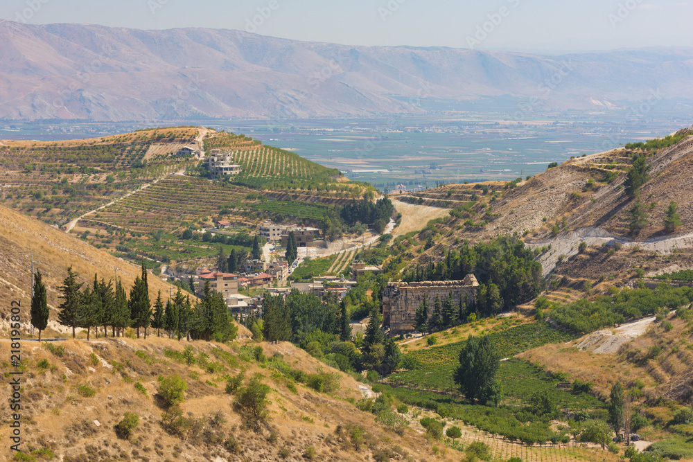 Panorama of the Bekaa Valley landscape with the Niha Roman temple, vineyard hills and mountains, in Zahle, Lebanon