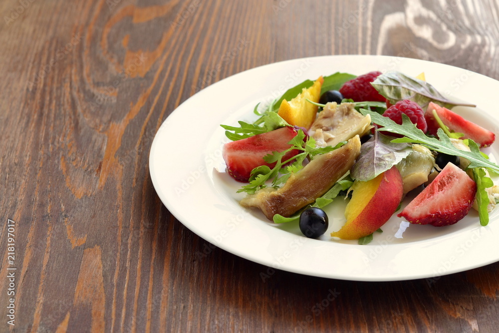 Chicken salad with fresh berries and arugula, copy space Chicken salad with fresh berries and arugula, copy space