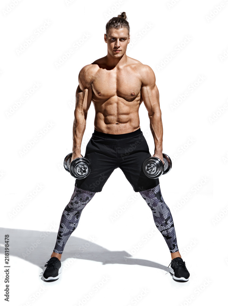 Sporty guy holding dumbbells. Photo of young guy with good physique isolated on white background. Strength and motivation. Full length Sporty guy holding dumbbells. Photo of young guy with good physique isolated on white background. Strength and motivation. Full length