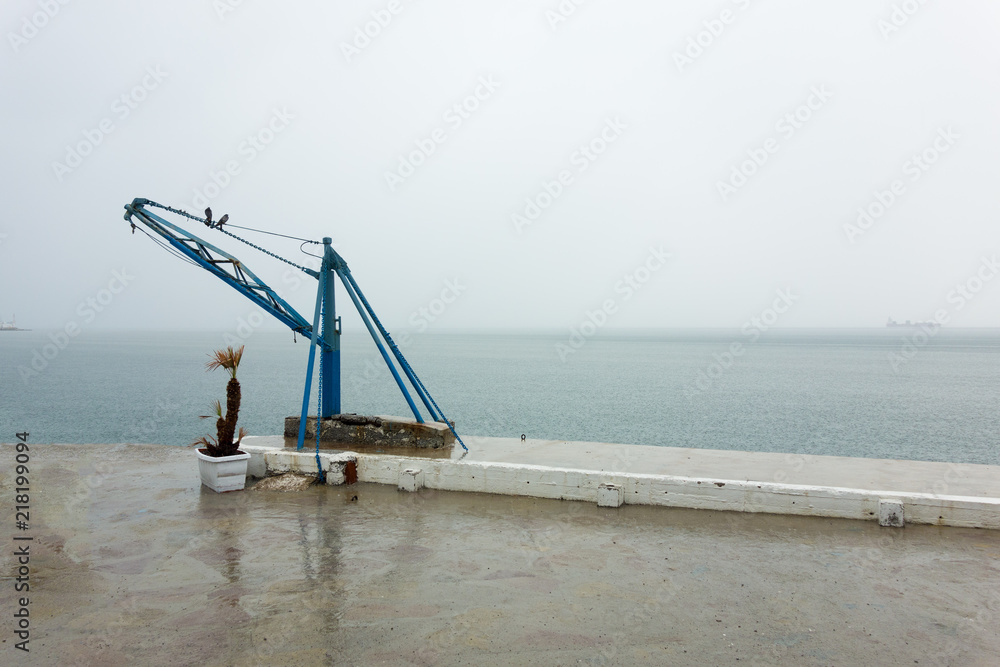 Fototapeta premium Two birds on a seaside crane, Thessaloniki, Greece