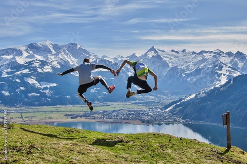 Men jumping from the peak in Alps © tadeas