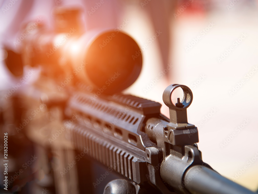 Optical sight on weapons close-up (danger, goal, terrorism - concept)