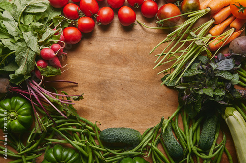 Fototapeta Naklejka Na Ścianę i Meble -  Frame of healthy green and red vegetables on wooden table
