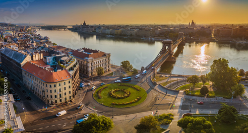 Budapest, Hungary - Panoramic aerial skyline view of Clark Adam square roundabout at sunrise with River Danube, Szechenyi Chain Bridge and St. Stephen's Basilica at background photo