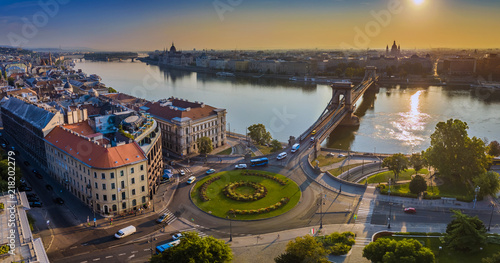 Budapest, Hungary - Panoramic aerial skyline view of Clark Adam square roundabout at sunrise with River Danube, Szechenyi Chain Bridge and St. Stephen's Basilica at background photo