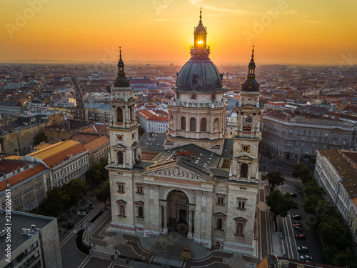 Budapest, Hungary - The rising sun shining through the tower of the beautiful St.Stephen's Basilica (Szent Istvan Bazilika) at sunrise on an aerial shot