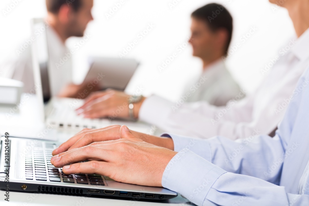 Closeup of a Businesspeople Working with Laptop and Computer Closeup of a Businesspeople Working with Laptop and Computer