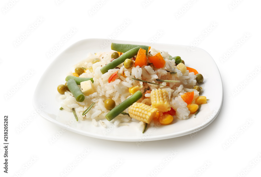 Plate with tasty boiled rice and vegetables on white background