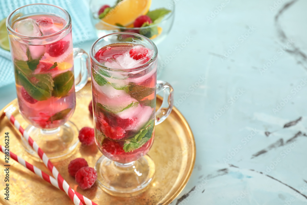 Glasses of fresh raspberry mojito on table Glasses of fresh raspberry mojito on table