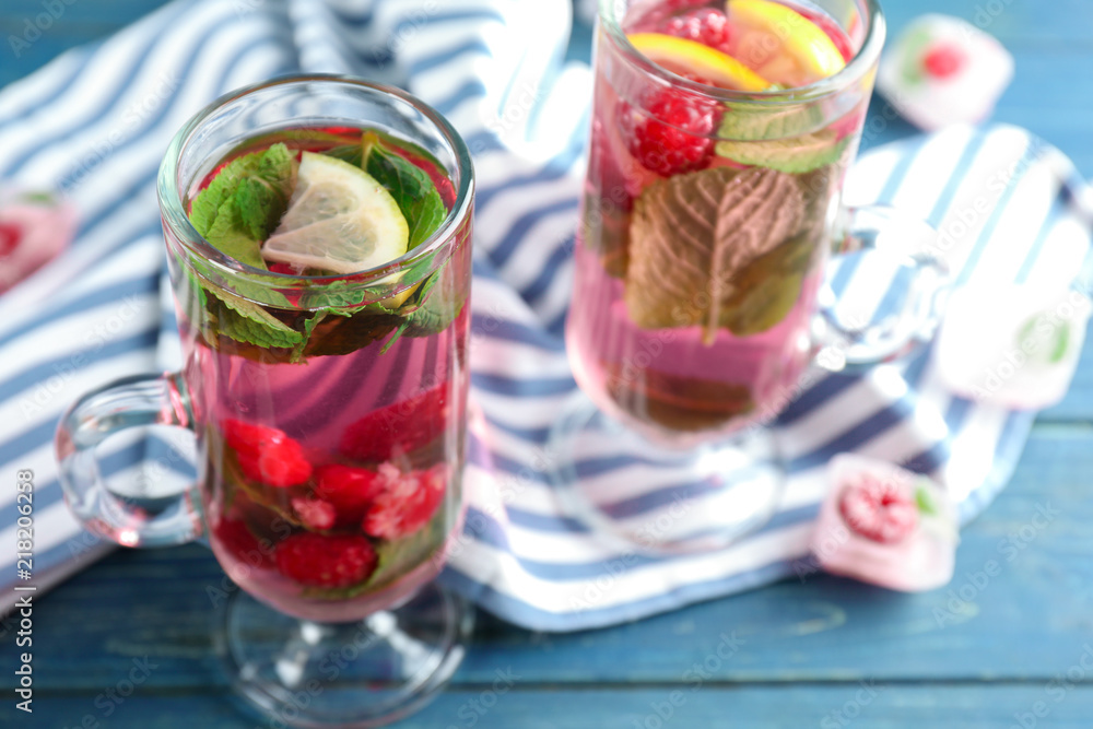 Glasses of fresh raspberry mojito on wooden table Glasses of fresh raspberry mojito on wooden table