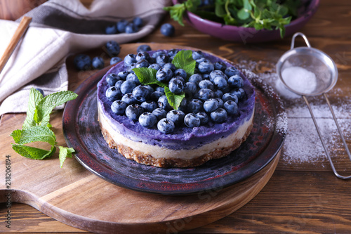 Wallpaper Mural Plate with delicious blueberry cheesecake on wooden table Torontodigital.ca