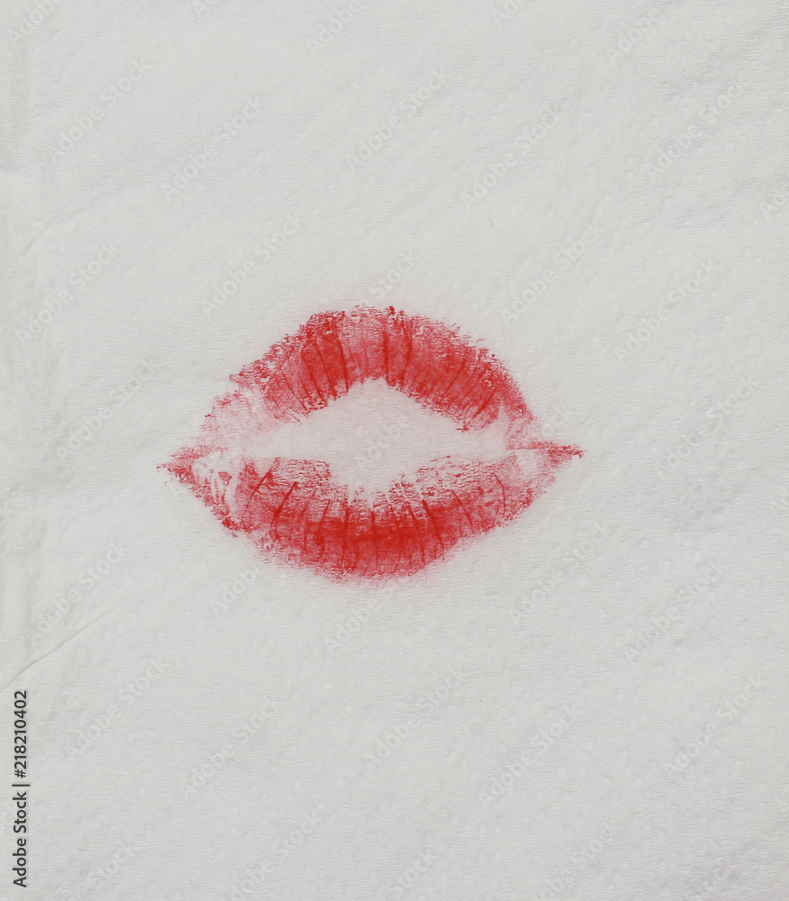 Fototapeta premium Woman to use red lipstick and kiss on the tissue paper background.