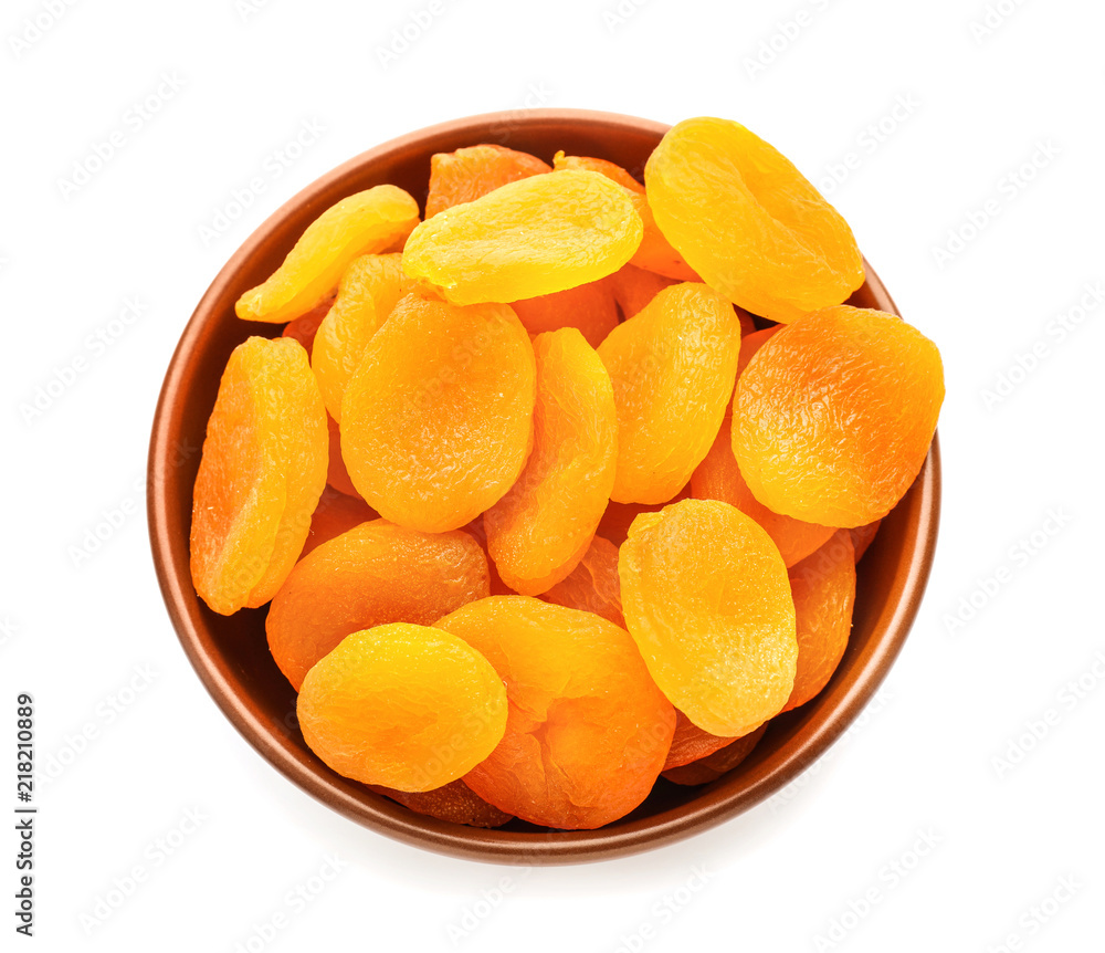 Bowl with dried apricots on white background Bowl with dried apricots on white background