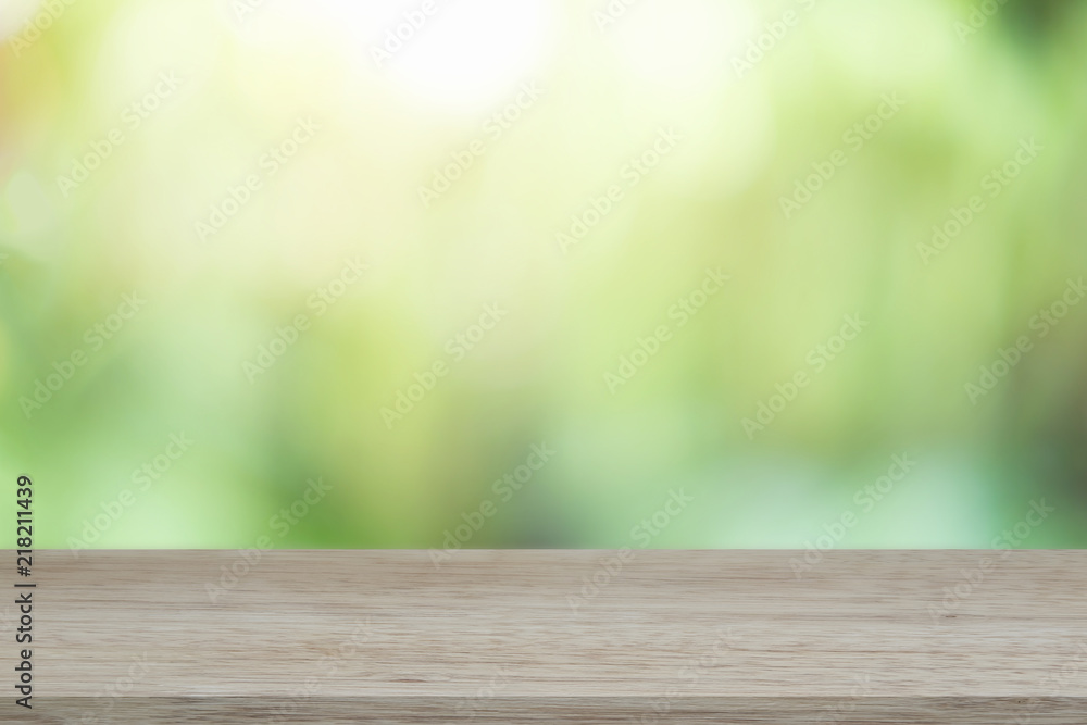 Empty wooden desk of free space and spring time with blurred background of home garden for a catering or food background,Template mock up for display montages of product. Empty wooden desk of free space and spring time with blurred background of home garden for a catering or food background,Template mock up for display montages of product.