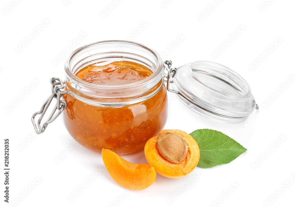 Jar with sweet apricot jam and fresh fruit on white background Jar with sweet apricot jam and fresh fruit on white background