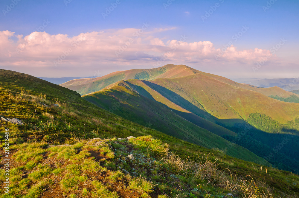 View of the mountain range at sunrise. Summer mountain landscape